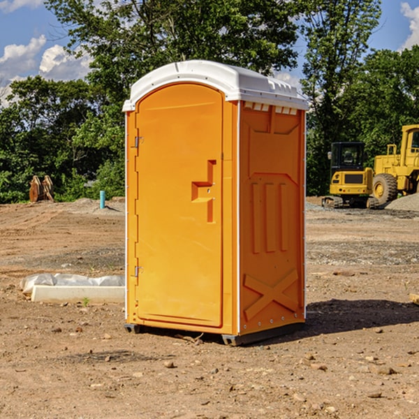 what is the cost difference between standard and deluxe portable restroom rentals in Okmulgee County